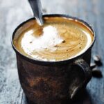 Old coffee cup on dark rustic  background