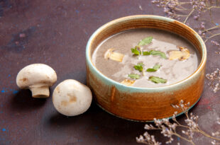 front close view delicious mushroom soup inside plate dark space