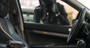 close up man trying break into car