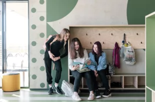 Girls are reading a book in school Renee Altrov